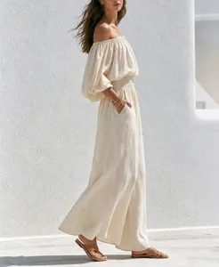 Detailed shot of women off shoulder linen jumpsuit, casual wide leg style, beige.