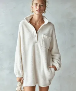 Cozy off-white sherpa fleece pullover dress with half button stand collar and pockets.