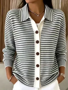 Close-up detail of striped knit cardigan featuring lapel collar and brown button closure.