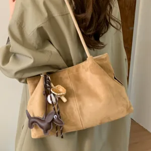 Retro brown suede shoulder tote bag for women, stylish autumn winter commuting bag with charms.