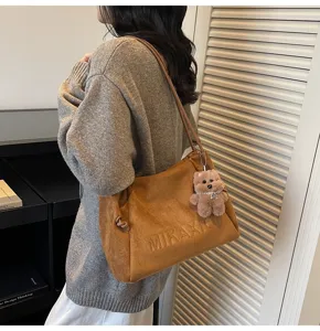 Retro brown suede large tote bag for women, casual commuter shoulder bag with cute bear pendant.