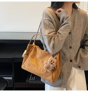 Brown suede tote shoulder bag for women, large capacity casual commuting underarm bag.