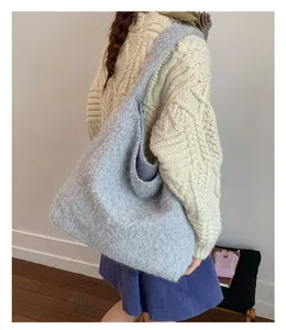 Detailed view of grey fuzzy shoulder tote bag, soft winter casual daily commuter bag