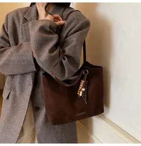Retro suede tote bag shoulder detail, brown casual daily commuting bag with beaded charm.