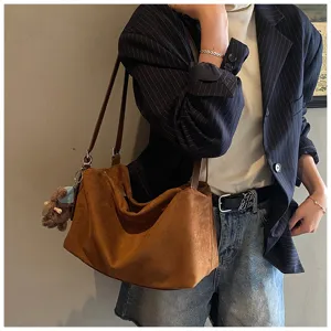 Detailed view of brown vintage suede tote bag, large capacity shoulder bag for women.
