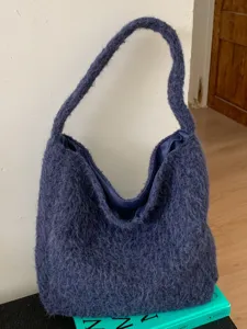 Blue fuzzy hobo bag for women, stylish winter casual shoulder tote handbag for daily commute.