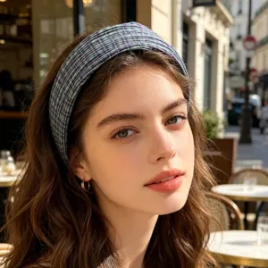Detailed close-up view of the chic plaid wide headband worn elegantly, showing fine texture.