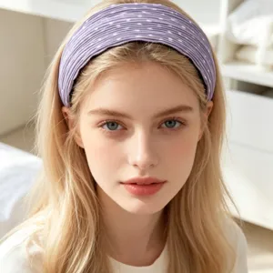 Close-up detail of the korean style purple pleated polka dot wide hair band worn nicely.