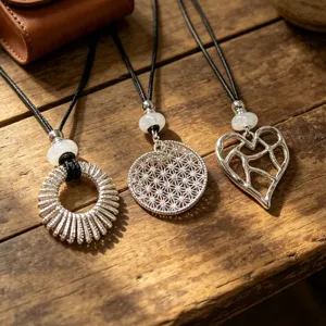 Exquisite silver pendant necklace set featuring intricate hollow geometric designs.