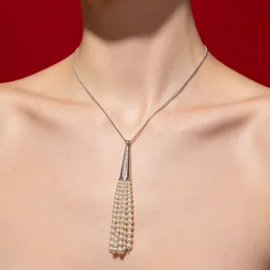 Elegant silver pearl tassel pendant necklace featuring multi-strand delicate pearls.