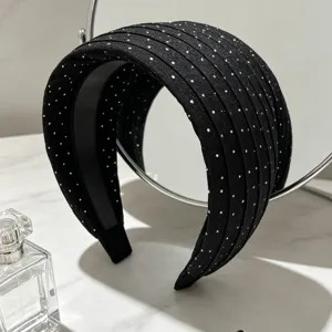 Serre-tête large noir élégant avec de subtils points argentés, accessoire de mode pour femme.