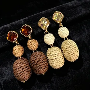Exquisite rhinestone and braided rope drop earrings detail, retro bohemian style charm.