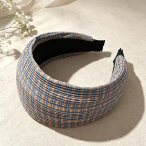 Blue orange plaid wide headband close up, stylish pleated fabric hair accessory for women.