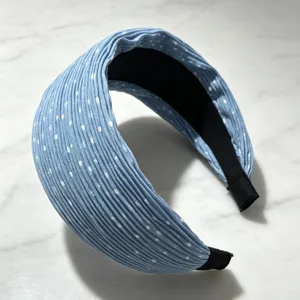 Detailed close-up view of blue pleated polka dot wide hairband, trendy Korean hair accessory.