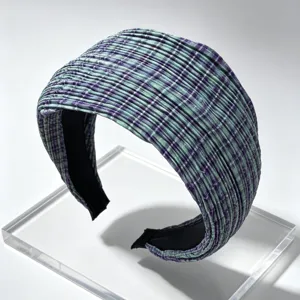 Close-up detail of Korean style pleated plaid wide headband in green and purple colors.