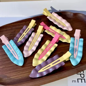 Detail view of pastel wavy metal duckbill hair clips set, aesthetic daily hair styling accessory.