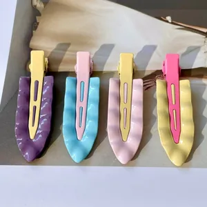 Metal wavy duckbill hair clips in pastel cream colors, stylish aesthetic hair styling tools.