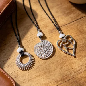 Silver hollow circle and heart pendant necklace with black cord for women daily wear.