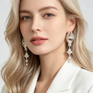 Artistic hand shape drop earrings with crystal clover tassels for women, elegant vintage style.