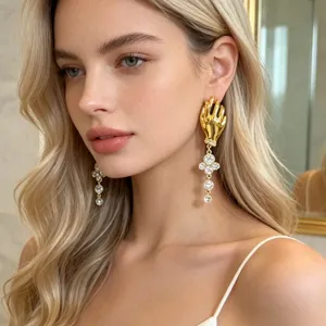 French vintage gold hand earrings with sparkling crystal tassels, chic statement jewelry for women.
