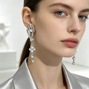 Detailed view of french vintage artistic hand shaped rhinestone long tassel earrings