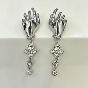 Vintage silver hand shape earrings with sparkling rhinestones and crystal drops.