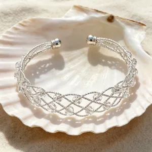 Bracciale rigido incrociato intrecciato in argento con perle di cristallo trasparente