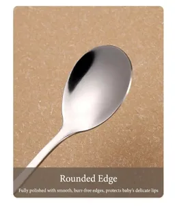 Stainless steel children's spoon detail shot, smooth polished edge for safe daily feeding use.