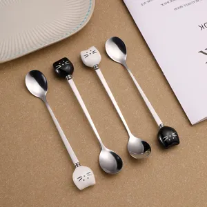 Stainless steel cat spoons with ceramic handle, perfect for coffee and dessert use.