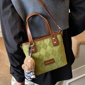 Stylish retro green textured shoulder bag for women, versatile commuter handbag with cute charm.