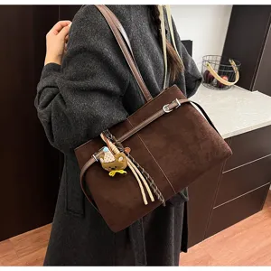 Brown suede tote bag for women winter Korean style chic shoulder bag with cute bear pendant.