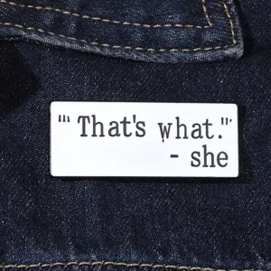 Metal enamel pin close-up featuring a funny quote design, perfect for jackets and backpacks.