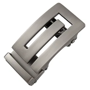 Detail view of a sleek gunmetal automatic belt buckle with a modern geometric cutout design.