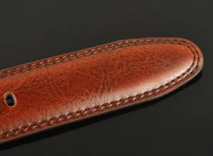 Brown leather belt detail shot showing vintage texture and fine stitching for men daily wear.