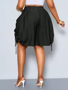 High waist black drawstring shorts back view showing pleated details and side pockets.