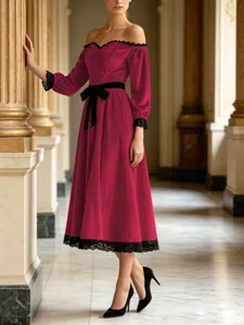 Detailed view of the elegant off-shoulder velvet midi evening dress with lace trim.