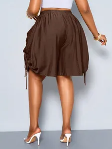 Back view of women high waist loose harem shorts with side drawstrings in dark brown color.