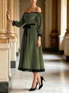 Detailed view of off-shoulder velvet midi dress with elegant lace trim and waist bow.