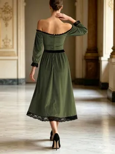 Green velvet midi dress with off-the-shoulder design and black lace trim for elegance.