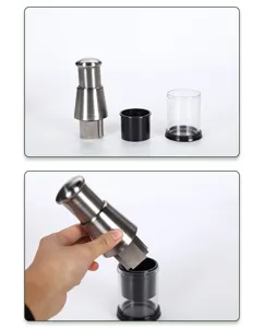 Stainless steel manual garlic chopper detail showing components and hand pressing action clearly.