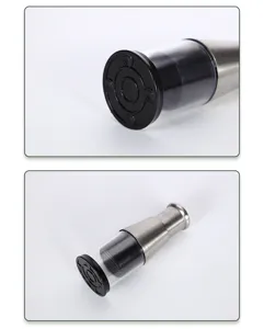 Stainless steel manual garlic press detail view showing transparent chamber and base.