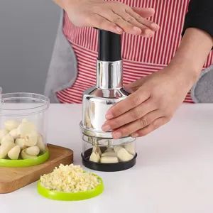Manual stainless steel garlic press and chopper for kitchen, efficient onion and ginger masher.