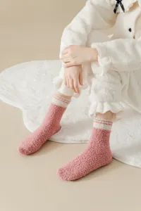 Cozy plush coral fleece detail shot, soft fuzzy texture, warm mid-calf winter socks display.