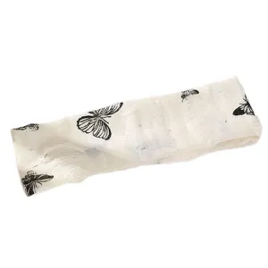 Bandeau à cheveux large en tissu vintage avec imprimé papillon noir et détails frangés.