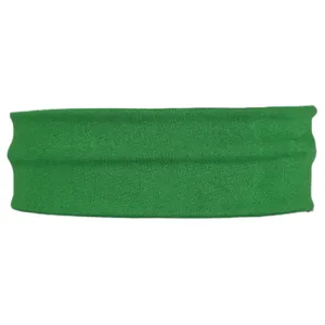 Close-up detail view of green elastic sports headband, showing stretchable knitted fabric.