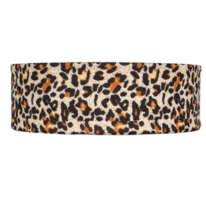 Detailed view of the leopard print elastic headband, showing soft fabric texture and wide design.