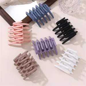 Matte cross hair claw clip set, minimalist chic shark clip detail view in multiple colors.
