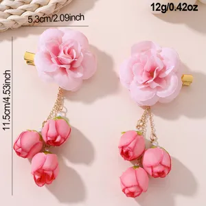 Pink fabric flower hair clip with delicate dangles, elegant Hanfu accessory detail.