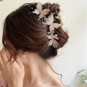 Elegant butterfly hair claw clip with sheer fabric details and pearls for women styling.