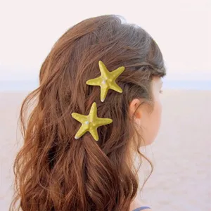 Yellow starfish hair clips detail view, ocean beach style hair accessory for women and girls.